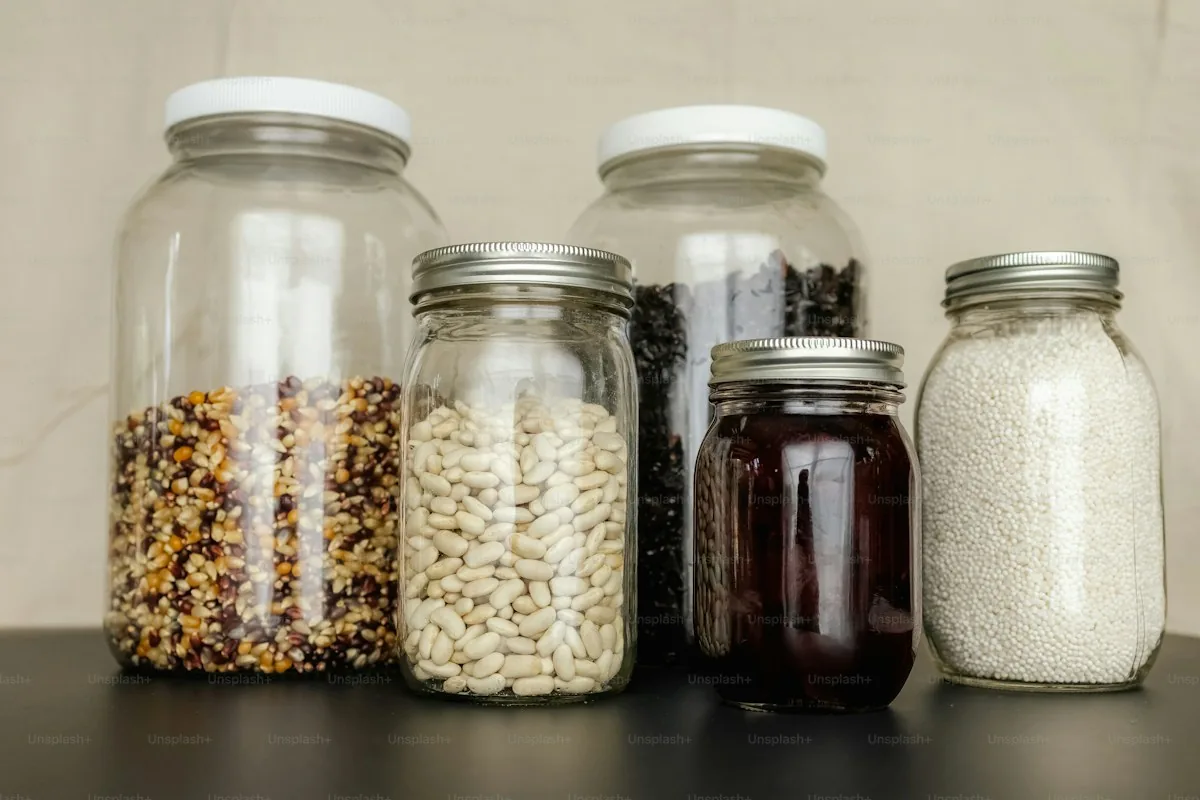 Jars of preserved food on a pantry shelf